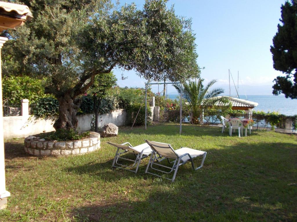 Eva apartments, Kassiopi, Imerolia, Garden with sea view in apartment 1 1